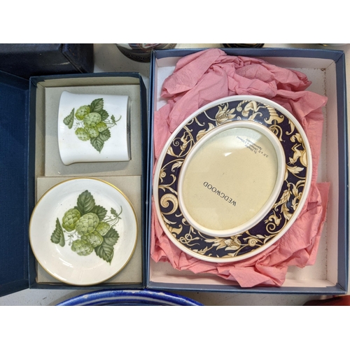 2 - A mixed lot of ceramics and china to include hanging decorative plates, a sacred art figure, some Or... 