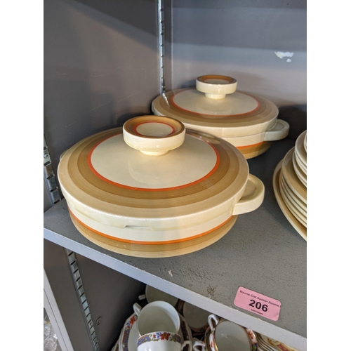 206 - A Clarice cliff part dinner service to include dinner plates side plater, a pair of lidded tureens a... 