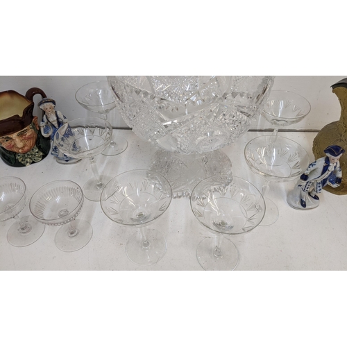 209 - A set of six Champagne saucers, a 19th century jug, a caricature jug, a large two part glass bowl, t... 