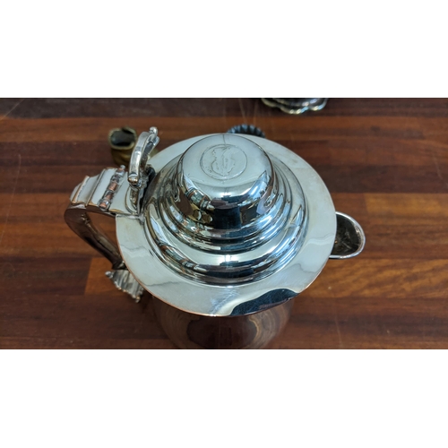 216 - Silver plate to include a 19th century silver plated tankard with a coin to the lid, a teapot, a sal... 