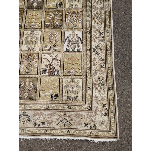 227 - A silk Turkish Hereke rug, the garden design, depicting different symbols and emblems in a 5x8 grid,... 