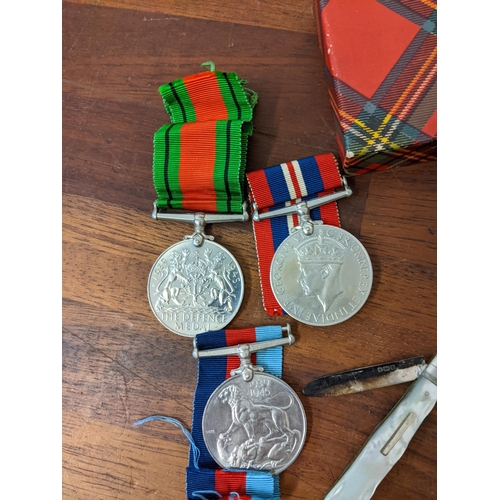 286 - World War I and II medals awarded to K Haydock and 102496 PTE RC Haydock R.A.M.C, a cap badge, a sil... 