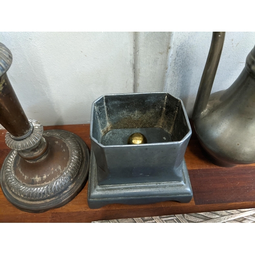 287 - Metalware to include two Middle Eastern style coffee pots, tobacco jar, candlestick, sandwich box an... 