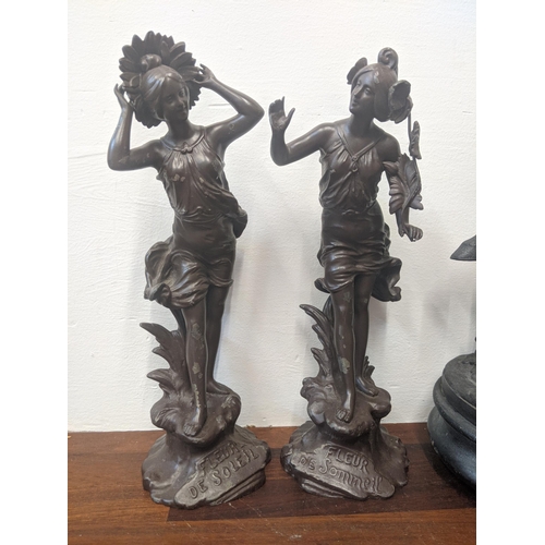 290 - Three spelter figures, two depicting two women, one marked 'fleur de Soleil' and the other 'Fleur de... 