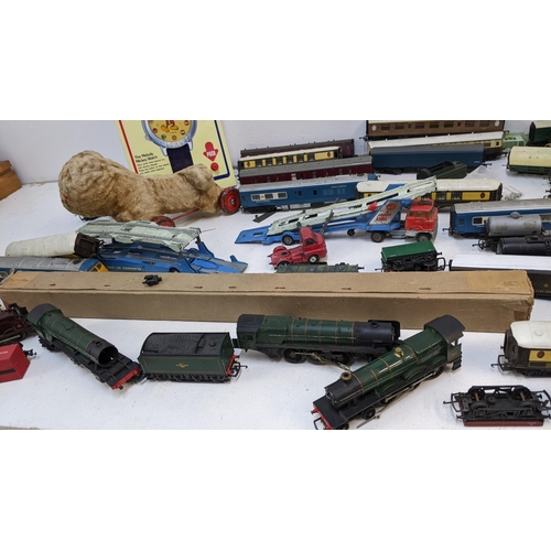 324 - Toys to  include 00 gauge plastic railway engines A/F, rolling stock and track, two Corgi, car trans... 