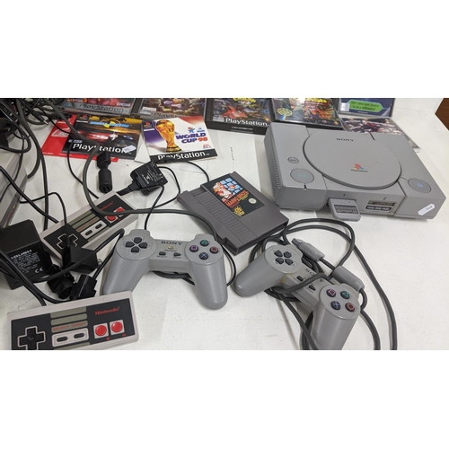 333 - A Playstation 1 console and Nintendo console with games and controllers
Location: R1-4
If there is n... 