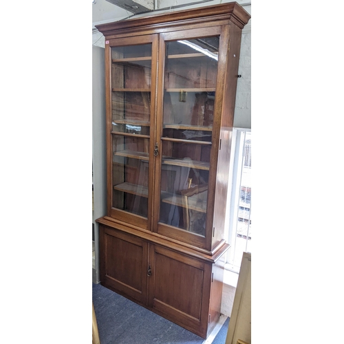 344 - THIS LOT IS WITHDRAWN
An early 20th century large mahogany two door glazed bookcase with two cupboar... 