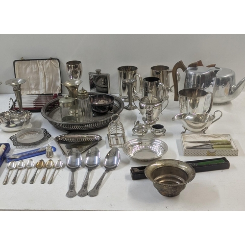 354 - A collection of mixed silver plated items to include tankards, cutlery and flatware, along with a mi... 