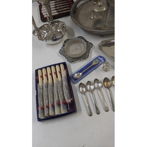 354 - A collection of mixed silver plated items to include tankards, cutlery and flatware, along with a mi... 