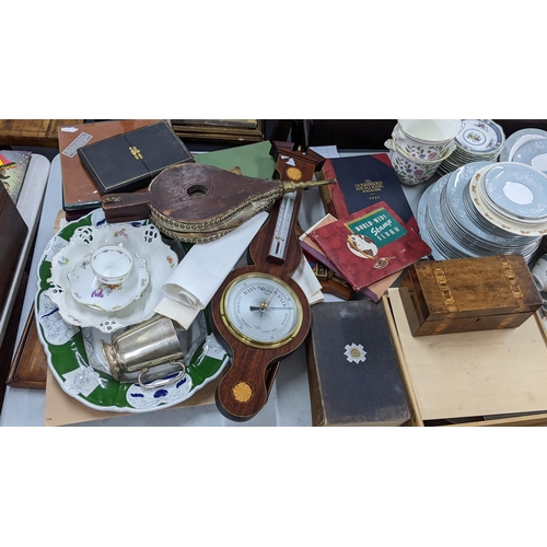 360 - A large mixed lot to include a 19th century tea caddy, fire bellows, barometer, stamps, Wedgwood and... 