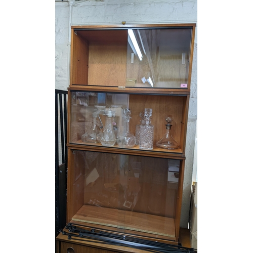 368 - THIS LOT IS WITHDRAWN
An Avalon retro teak Ladderax style unit consisting of six cabinets, twelve ro... 