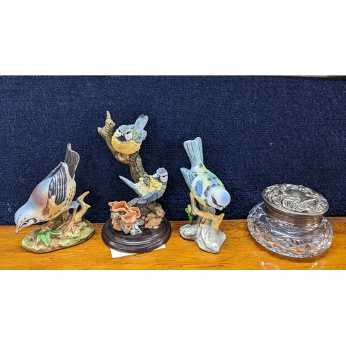 376 - Two porcelain model birds, a Country Artists model and a modern silver topped glass jar together wit... 