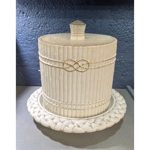 379 - A Victorian cream ware 'Bamboo' pattern cheese dome on a later base, 30cm, h
Location: 3-1
If there ... 