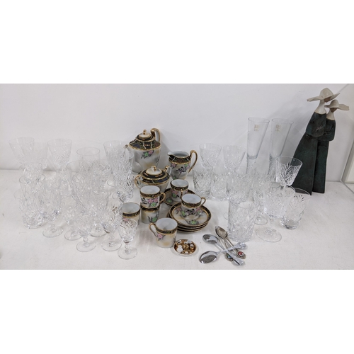 381 - A mixed lot to include a figural Lladro group of two nuns, glassware, a Japanese tea service and cut... 