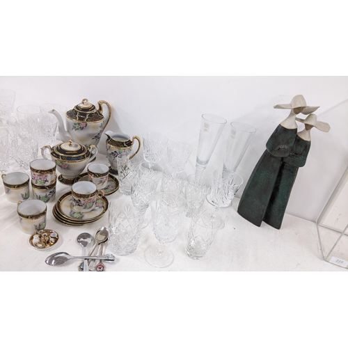 381 - A mixed lot to include a figural Lladro group of two nuns, glassware, a Japanese tea service and cut... 