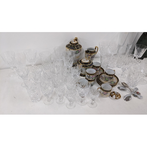 381 - A mixed lot to include a figural Lladro group of two nuns, glassware, a Japanese tea service and cut... 