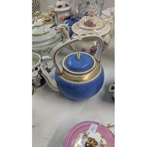 384 - A collection of Victorian and later teapots to include a blue white and gold bates and Walker & Co e... 