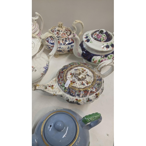 384 - A collection of Victorian and later teapots to include a blue white and gold bates and Walker & Co e... 