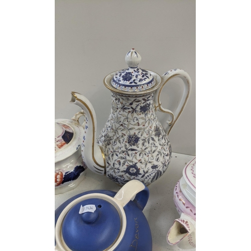 384 - A collection of Victorian and later teapots to include a blue white and gold bates and Walker & Co e... 