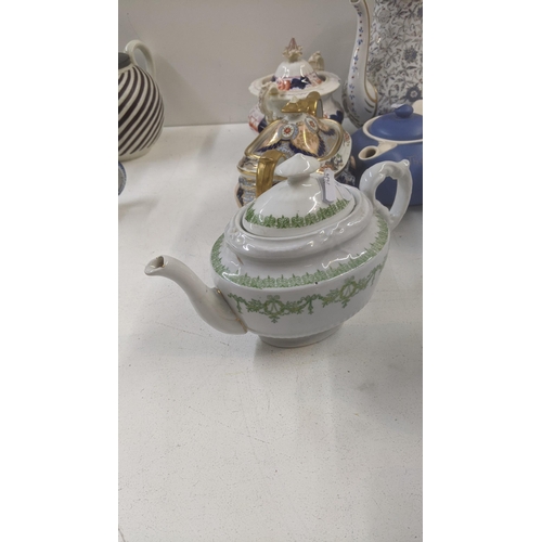 384 - A collection of Victorian and later teapots to include a blue white and gold bates and Walker & Co e... 