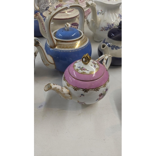 384 - A collection of Victorian and later teapots to include a blue white and gold bates and Walker & Co e... 