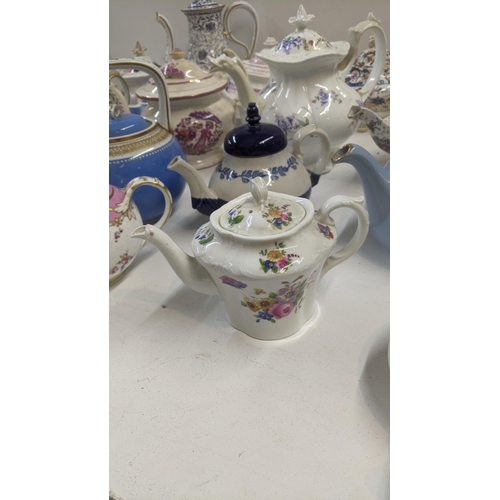 384 - A collection of Victorian and later teapots to include a blue white and gold bates and Walker & Co e... 