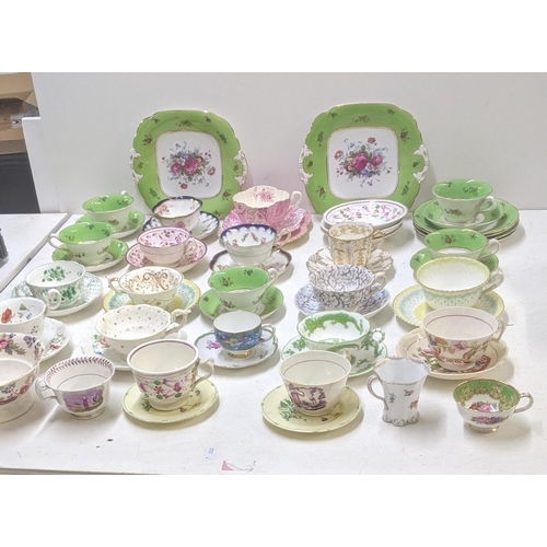 385 - A mixed lot of Victorian and later cups and saucers to include a Coalport cup and saucer decorated w... 