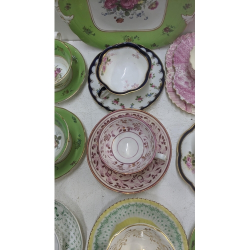 385 - A mixed lot of Victorian and later cups and saucers to include a Coalport cup and saucer decorated w... 