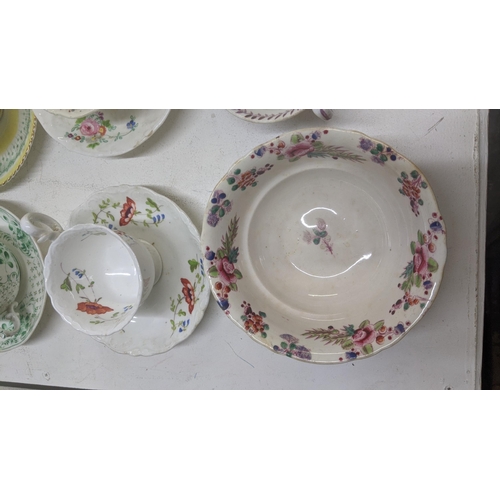 385 - A mixed lot of Victorian and later cups and saucers to include a Coalport cup and saucer decorated w... 