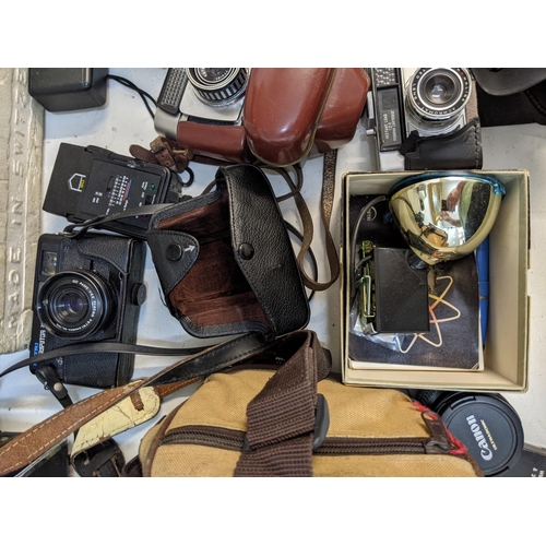 4 - Photographic equipment to include a Polaroid Land Camera Automatic 103, a Canon Reflex Zoom 8-2, an ... 