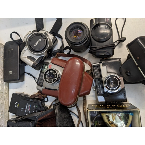 4 - Photographic equipment to include a Polaroid Land Camera Automatic 103, a Canon Reflex Zoom 8-2, an ... 