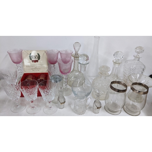 424 - Mixed glassware to include decanters, two late Victorian silver rimmed hurricane glasses and others
... 