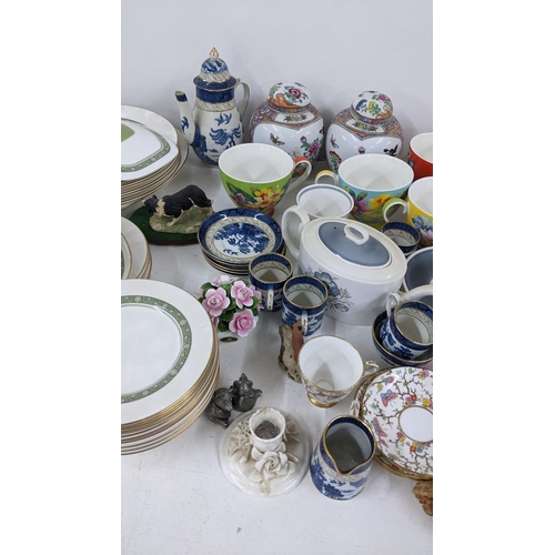 425 - A mixed lot to include two Clarice Cliff Honeyglaze bizarre platters, Booths blue and white china an... 