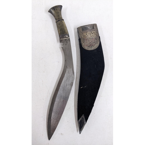 429 - An early 20th century horn handled Kukri with an inscribed presentation plaque together with an Iris... 