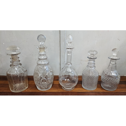 44 - A collection of crystal cut glass decanters, four scent bottles and a glass jug
Location:4.3
If ther... 