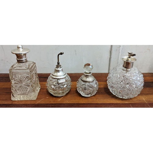 44 - A collection of crystal cut glass decanters, four scent bottles and a glass jug
Location:4.3
If ther... 