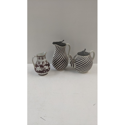 491 - Two Victorian stone ware items by T Booth Hanley to include a tea pot and pitcher both having pewter... 