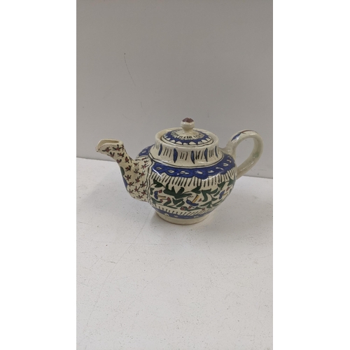 492 - Victorian and later tea pots to include a Iznik tea pot, an Oriental tea pot, a Yak butter tea pot a... 