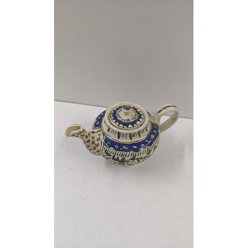 492 - Victorian and later tea pots to include a Iznik tea pot, an Oriental tea pot, a Yak butter tea pot a... 