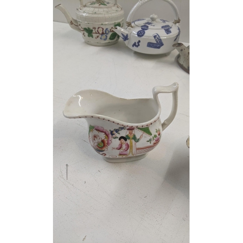 492 - Victorian and later tea pots to include a Iznik tea pot, an Oriental tea pot, a Yak butter tea pot a... 