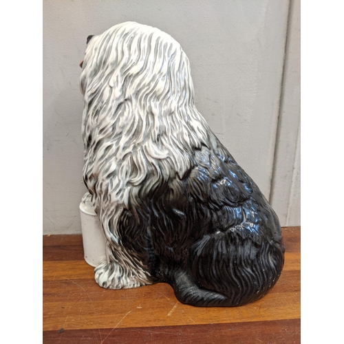 6 - A Beswick model of the Dulux dog Location:1.2
If there is no condition report shown, please request