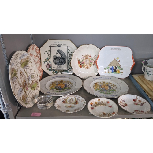 92 - A mixed lot of china and ceramics to include commemorative ware, a Lladro model, two Nao figures and... 