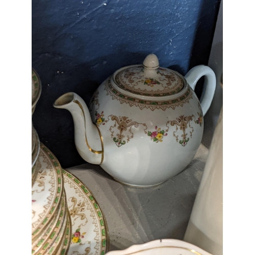 93 - An Aynsley Bridgwood tea and coffee service to include cups and saucers with a tea and coffee pot Lo... 