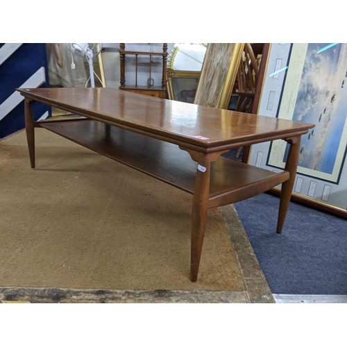 94 - A G-Plan teak coffee table on short tapered legs united by an underlying shelf Location:BWR
If there... 