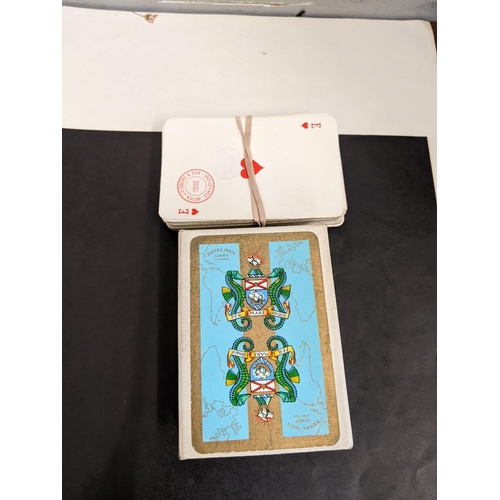 99 - Two packs of playing cards to include an unopened pack stamped and manufactured by JO Oberg & Son an... 