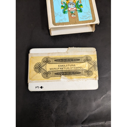 99 - Two packs of playing cards to include an unopened pack stamped and manufactured by JO Oberg & Son an... 