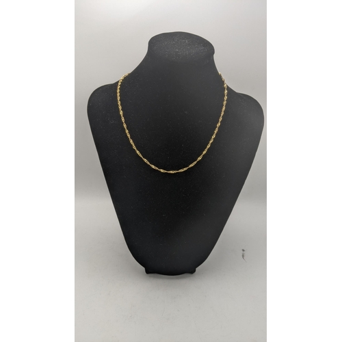 26 - Two 9ct gold necklaces to include a twisted style necklace with chain link necklace with a very smal... 