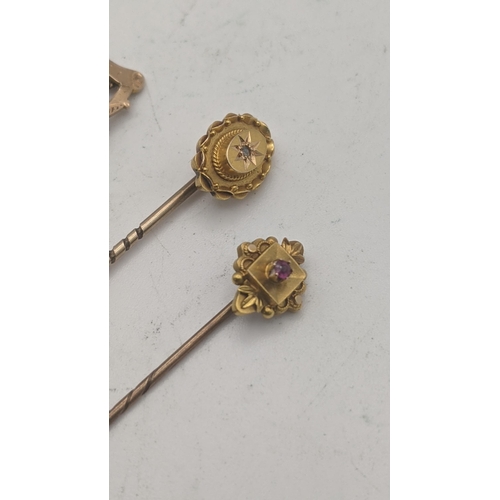 41 - Three 15ct gold stick pins all on yellow gold pins tested as 9ct to include a Victorian example set ... 