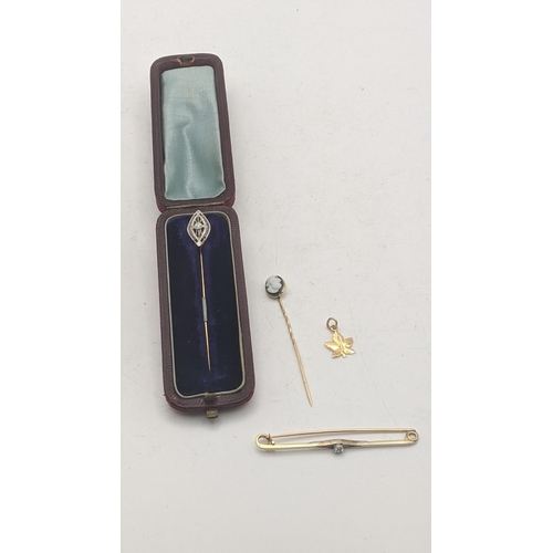 42 - 14ct gold and yellow gold tested as 14ct gold to include a 14ct Art Deco stick pin set with a diamon... 