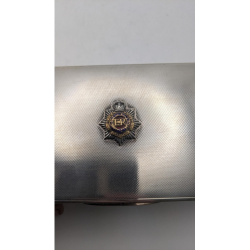 45 - A silver cigarette box with an engine turned lid and also having a Royal army service corks to the t... 